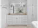 Bright bathroom features a double vanity with large mirrors and linen closet at 1116 Dan Johnson Ne Rd, Atlanta, GA 30307
