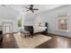 Spacious bedroom with hardwood floors, ceiling fan, and natural light from windows at 1116 Dan Johnson Ne Rd, Atlanta, GA 30307
