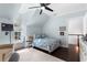 Light blue bedroom with a ceiling fan, hardwood floors, a dormer window, and a cozy sitting area at 1116 Dan Johnson Ne Rd, Atlanta, GA 30307