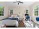 Bright bedroom with hardwood floors, lots of natural light, desk, and decorative rug at 1116 Dan Johnson Ne Rd, Atlanta, GA 30307