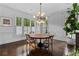 Dining area with hardwood floors, round table, and natural lighting from windows at 1116 Dan Johnson Ne Rd, Atlanta, GA 30307