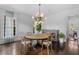 Bright dining room with hardwood floors, round table, and modern chandelier at 1116 Dan Johnson Ne Rd, Atlanta, GA 30307