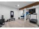 Modern exercise room featuring a wall-mounted mirror, free weights, and a treadmill at 1116 Dan Johnson Ne Rd, Atlanta, GA 30307