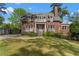 Classic brick home with a manicured lawn, lush landscaping, and inviting entryway, offering timeless curb appeal at 1116 Dan Johnson Ne Rd, Atlanta, GA 30307