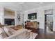Comfortable living room with a fireplace, entertainment center, and hardwood floors at 1116 Dan Johnson Ne Rd, Atlanta, GA 30307