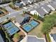 Aerial view of the home, pickleball, and tennis court, show the neighborhood's convenience at 348 Ellington Dr, Canton, GA 30115