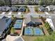 Aerial view of the home, pickleball, and tennis court, show the neighborhood's amenities at 348 Ellington Dr, Canton, GA 30115