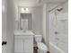 Bathroom features white cabinets, a mirror, and a shower-tub combo, for a clean and classic look at 348 Ellington Dr, Canton, GA 30115