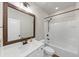 Classic bathroom with tub-shower combo, wood-framed mirror, and white vanity at 348 Ellington Dr, Canton, GA 30115