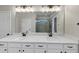 Modern bathroom featuring double sinks, a large mirror, and a glass-enclosed shower at 348 Ellington Dr, Canton, GA 30115