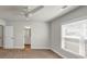Spacious bedroom with ensuite bathroom, ceiling fan, and window at 348 Ellington Dr, Canton, GA 30115