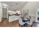 Community kitchen with stainless appliances provides a clean, bright social area with dining at 348 Ellington Dr, Canton, GA 30115
