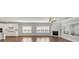 Bright living room featuring a fireplace, hardwood floors, and kitchen view at 348 Ellington Dr, Canton, GA 30115