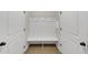 Mudroom with built-in bench and hooks at 348 Ellington Dr, Canton, GA 30115