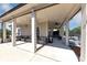Relaxing outdoor lounge with comfortable seating and ceiling fans overlook the pickleball court at 348 Ellington Dr, Canton, GA 30115