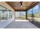 Covered patio with ceiling fan and view of the backyard at 348 Ellington Dr, Canton, GA 30115