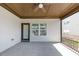 Relaxing outdoor patio with ceiling fan, railings, door and window offers a comfortable and inviting space at 348 Ellington Dr, Canton, GA 30115