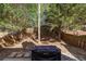 Fenced backyard with mature trees and large grill. The perfect space for entertaining! at 373 Hidden Creek Ln, Canton, GA 30114