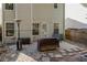 View of the private, fenced-in backyard with patio, grill, heater, and storage bench at 373 Hidden Creek Ln, Canton, GA 30114