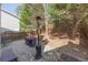 Shady fenced backyard with a patio area, grill, and garden bed at 373 Hidden Creek Ln, Canton, GA 30114