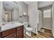 Bathroom featuring a single sink vanity, shower, and adjacent toilet at 373 Hidden Creek Ln, Canton, GA 30114