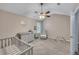 Charming Bedroom featuring a crib, changing table, glider and plush carpeting at 373 Hidden Creek Ln, Canton, GA 30114
