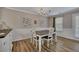 Cozy dining area with modern table set and stylish wall decor, perfect for Gathering meals and gatherings at 373 Hidden Creek Ln, Canton, GA 30114