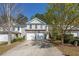 Charming two-story home featuring a two-car garage and traditional design with a well-maintained front yard at 373 Hidden Creek Ln, Canton, GA 30114