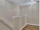 This hallway shows the transition from one level to another in a neutrally painted home at 373 Hidden Creek Ln, Canton, GA 30114