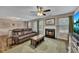 Inviting living room with a fireplace, comfortable seating, and an adjacent dining area for easy entertaining at 373 Hidden Creek Ln, Canton, GA 30114