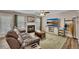 Comfortable living room with a fireplace, modern TV, plush seating, and stylish decor for a cozy atmosphere at 373 Hidden Creek Ln, Canton, GA 30114