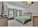A comfortably sized main bedroom with ceiling fan, neutral color palette, and ample natural light at 373 Hidden Creek Ln, Canton, GA 30114