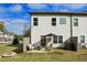 View of the backyard and patio with outdoor seating, an umbrella, and a fenced yard at 375 Crider Ct, Woodstock, GA 30188