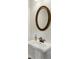 Bathroom features a pedestal sink, bronze faucet, and an oval mirror at 375 Crider Ct, Woodstock, GA 30188