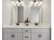 Bathroom featuring double sinks, white countertops, modern faucets, and new cabinetry at 375 Crider Ct, Woodstock, GA 30188