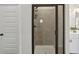 Bathroom featuring an enclosed shower with glass door, modern fixtures, and white vanity at 375 Crider Ct, Woodstock, GA 30188