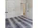 A bedroom with carpet and gray and white bedding with white walls and closets at 375 Crider Ct, Woodstock, GA 30188