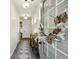 Inviting hallway features modern decor, a stylish rug, and a view into the home's interior spaces at 375 Crider Ct, Woodstock, GA 30188