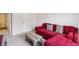 Comfortable living room with a red sectional sofa, neutral walls, and a modern coffee table on carpet at 375 Crider Ct, Woodstock, GA 30188