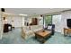Finished basement with a couch, armchair, and a lovely garden view from the sliding glass doors at 7470 Princeton Trce, Sandy Springs, GA 30328