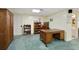 Office space in the basement with desk, bookshelves, and large storage cabinet at 7470 Princeton Trce, Sandy Springs, GA 30328
