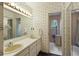 Spacious bathroom with a double sink vanity, large mirror and open shower space at 7470 Princeton Trce, Sandy Springs, GA 30328