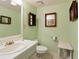 Bathroom featuring a single sink vanity, tiled floor, and green walls at 7470 Princeton Trce, Sandy Springs, GA 30328