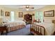 Cozy bedroom with twin beds, vintage furniture, and serene window views at 7470 Princeton Trce, Sandy Springs, GA 30328