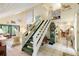 Bright foyer featuring staircase, tile flooring, and an open layout to the living area at 7470 Princeton Trce, Sandy Springs, GA 30328