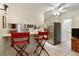 View of kitchen featuring a breakfast bar with seating, stainless steel refrigerator, and tile flooring at 7470 Princeton Trce, Sandy Springs, GA 30328