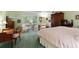 Light-filled bedroom featuring vintage furnishings, desk, and large windows overlooking trees at 7470 Princeton Trce, Sandy Springs, GA 30328