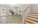 Finished basement with tile flooring, staircase, and walkout to the back yard at 1561 Mosaic Way, Smyrna, GA 30080