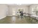Finished basement with tile flooring, bright lighting, and outdoor access at 1561 Mosaic Way, Smyrna, GA 30080