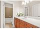 Bathroom featuring wood cabinets with a white countertop and a white sink at 1561 Mosaic Way, Smyrna, GA 30080